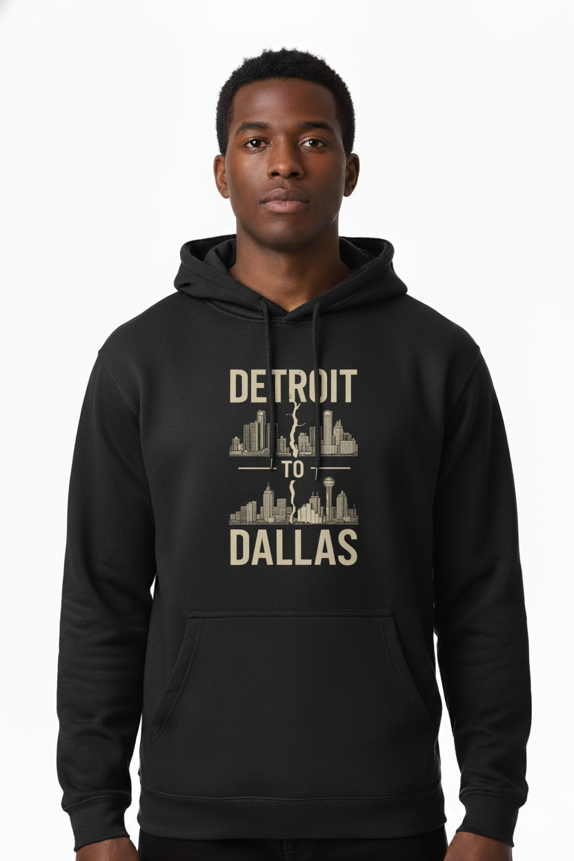 Person wearing a black hoodie with 'Detroit to Dallas' text and cityscape design.
