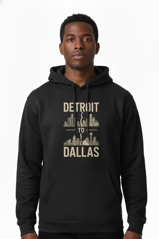 Person wearing a black hoodie with 'Detroit to Dallas' text and cityscape design.