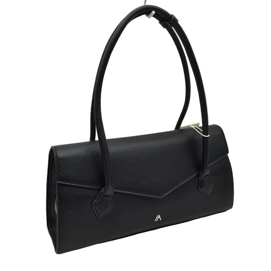 A black leather handbag with a structured envelope-style body, dual top handles, a flap closure, and a small gold logo on the front, photographed against a light gray studio background.