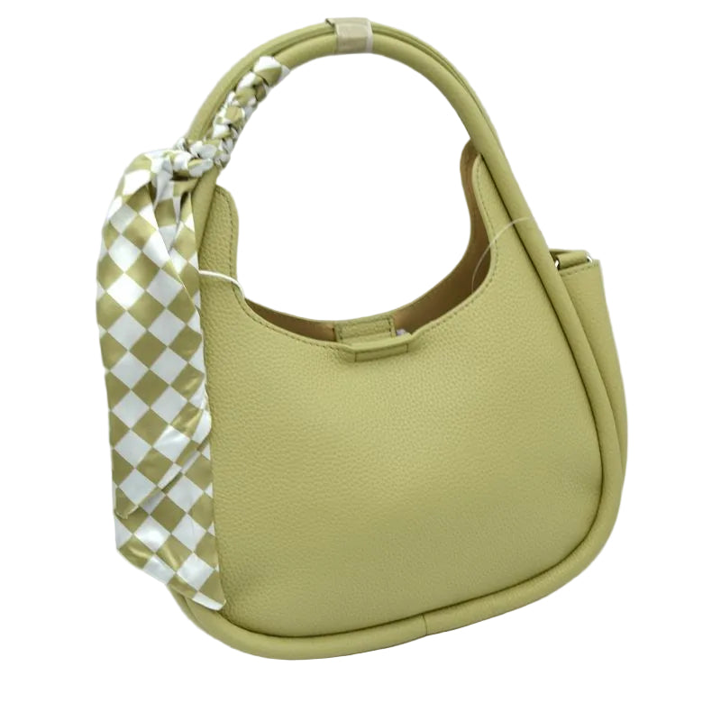 A light olive green pebbled leather shoulder bag with a matching woven leather top handle and a decorative woven side strap featuring a white and olive green checkered pattern, set against a plain white background.